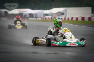 Alex Rogowski numer 202 AMO Racing Team w deszczu podczas Kartingowych Mistrzostw Polski w Bydgoszczy