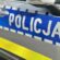 Radiowóz policyjny - zbliżenie na napis Policja